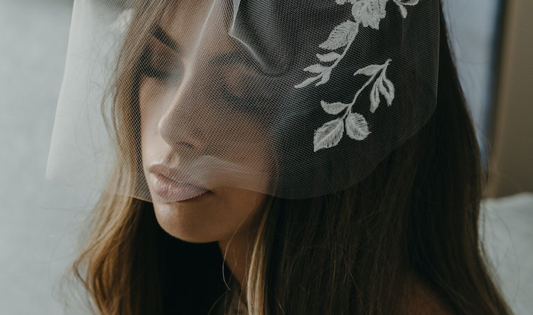 Romantic hairstyles for birdcage veils
