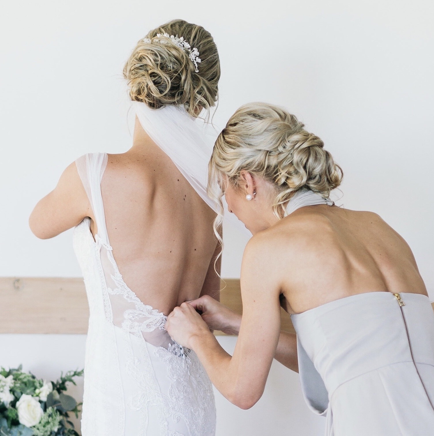 Bride Simone wearing veil below an updo