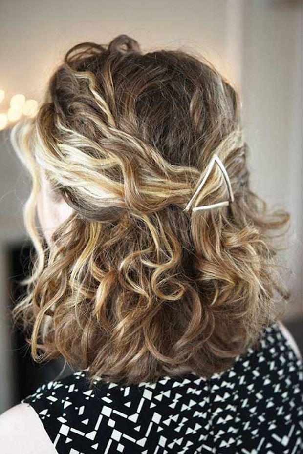 Naturally curly half up hairstyle with clip