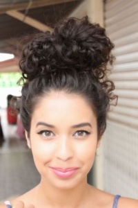 Naturally curly top knot wedding bun