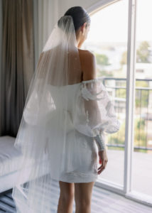 Bride Caitlin wears Theodore veil and Seychelles earrings 1