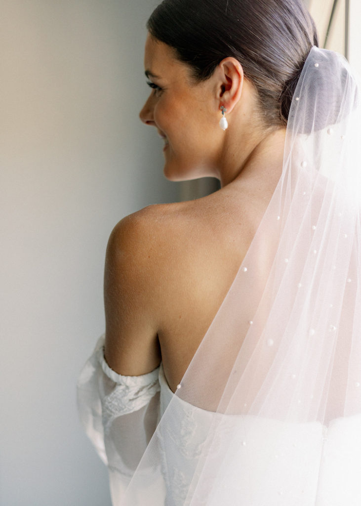 Bride Caitlin wears Theodore veil and Seychelles earrings 2
