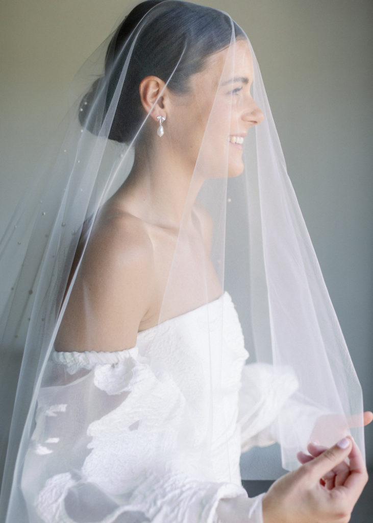 Bride Caitlin wears Theodore veil and Seychelles earrings 7