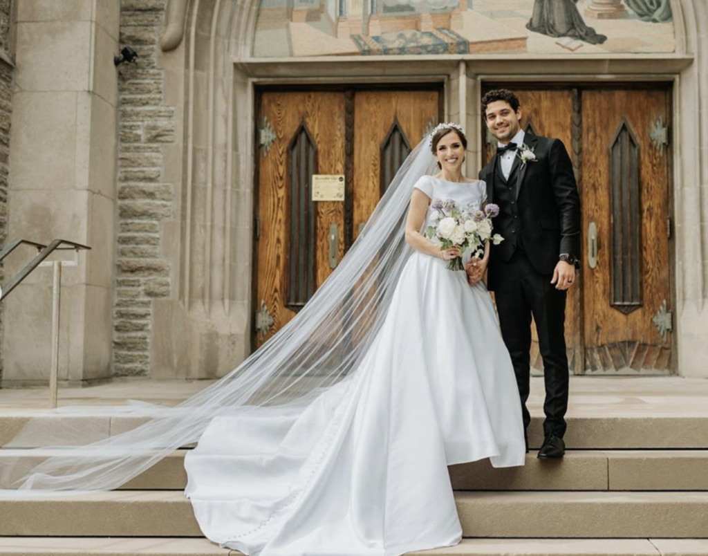 Bride Samantha wears long wedding veil