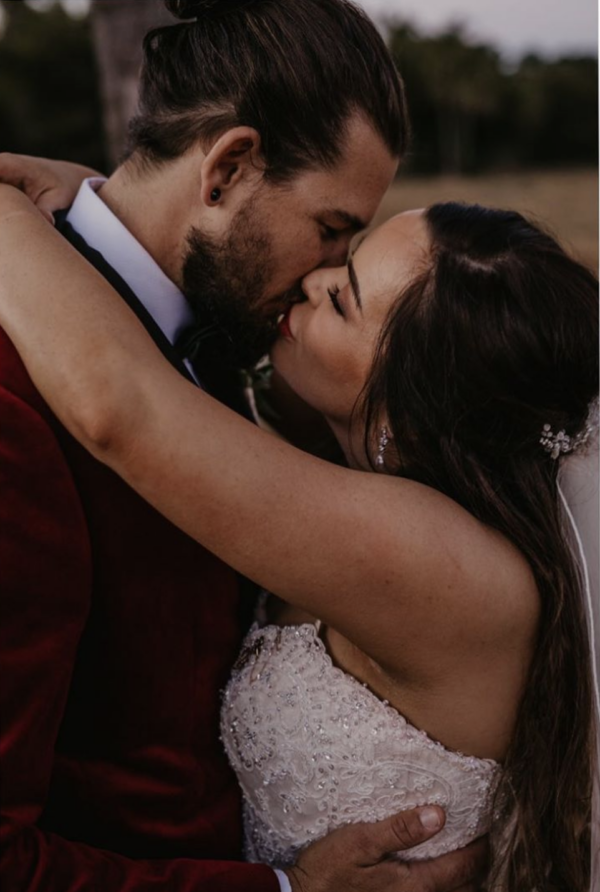Bride Casey Wears The Tulip Earrings.png