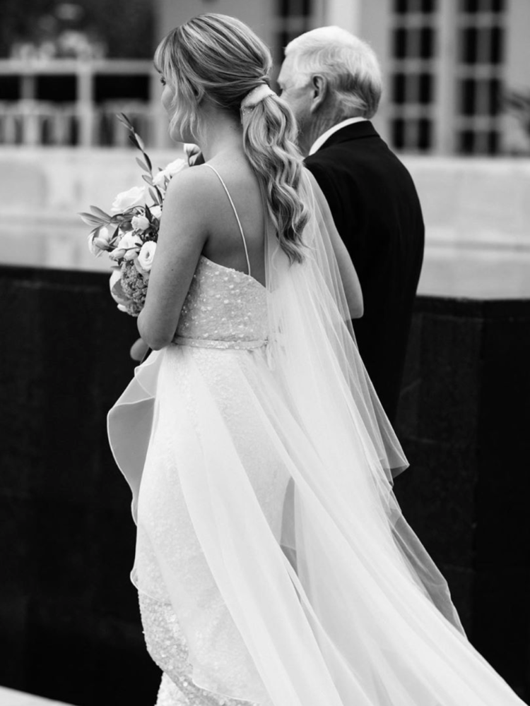 Bride Melanie Wears The Bordeaux Pony Tail Veil 1 E1572647273109.png