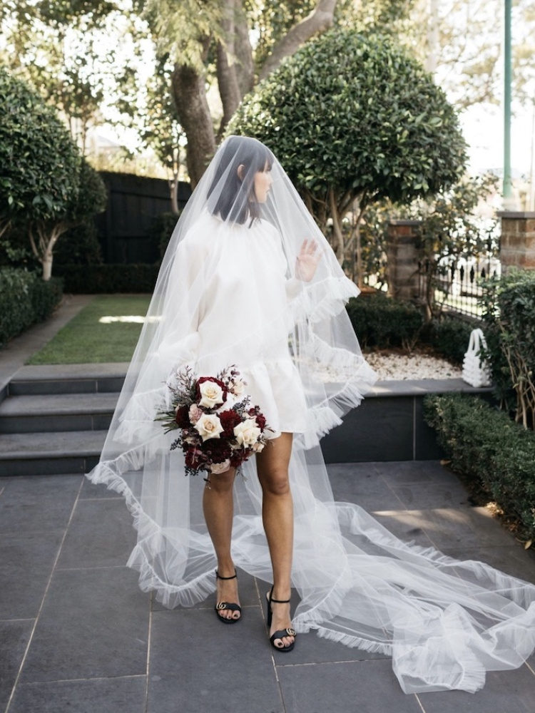 Your Guide To Styling A Short Wedding Dress With A Veil 11